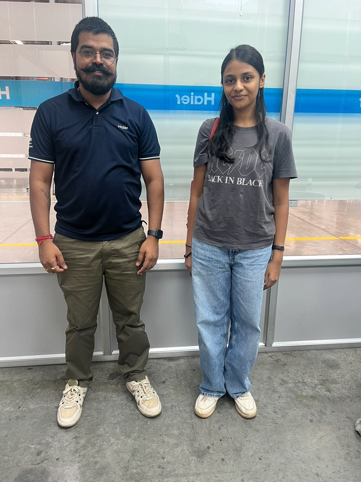 Anagha with an engineer at the Haier plant