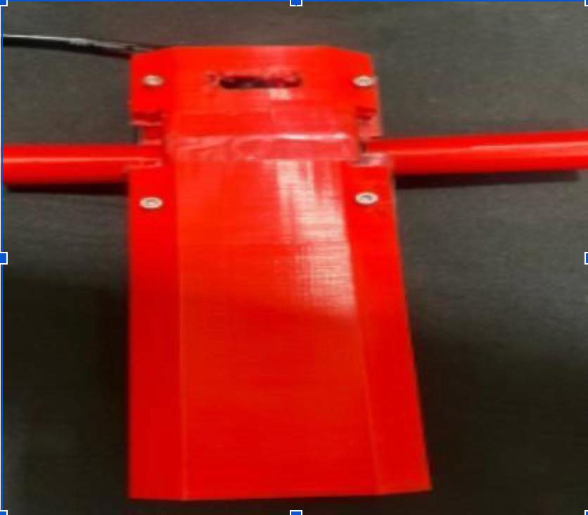 Red 3D-printed enclosure with connected tubing